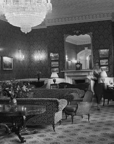 Historic black and white photo of hotel lounge