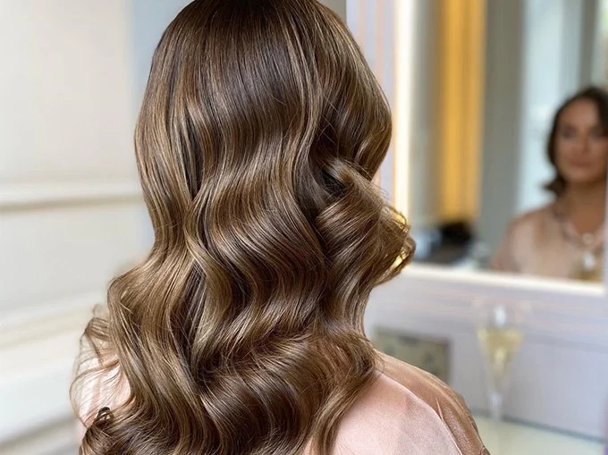 Flight of whiskey glasses on a wooden tray
