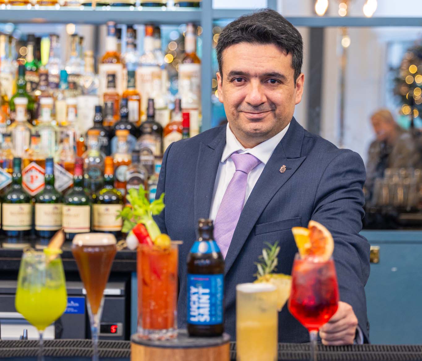 Bartender with colorful drinks