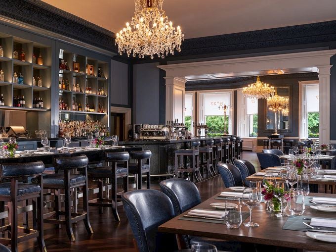 Elegant restaurant with chandeliers and bar seating