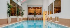 Indoor swimming pool with lounge chairs