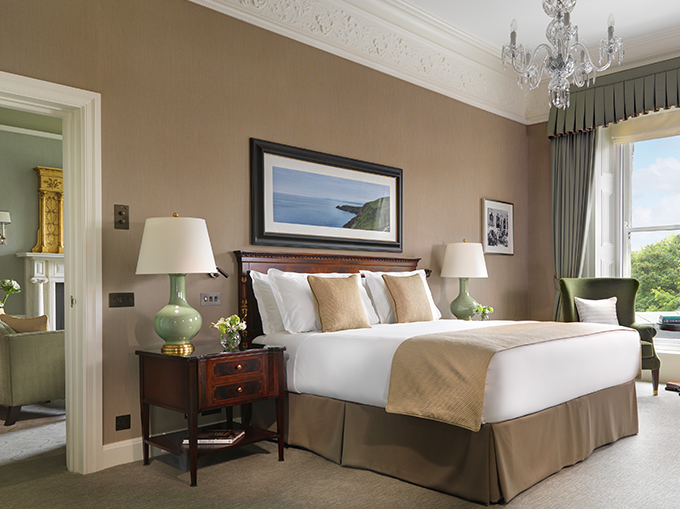 Elegant bedroom with neutral tones and chandelier