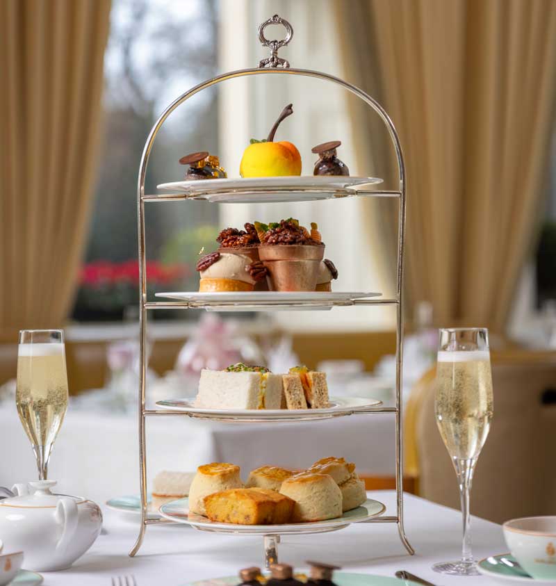 Afternoon tea service with champagne and three-tier stand